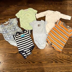 Five short sleeve onesies and one long sleeve onesie size 0 to 3 months